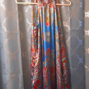 A cute silky dress ties around neck in the back has a beautiful print.